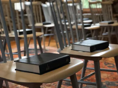 Chairs with bibles on them