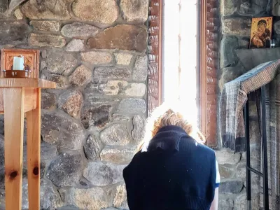 Woman praying in chapel
