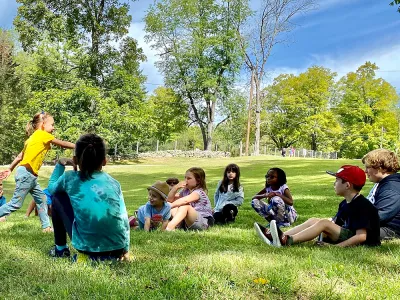 Kids play on the lawn at the Trinity Retreat Center