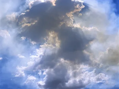 Image of sunlight behind a cloud against a blue sky