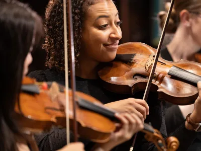 Close-up of violinists from Trinity Baroque Orchestra 
