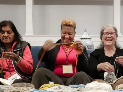 Friends knitting together