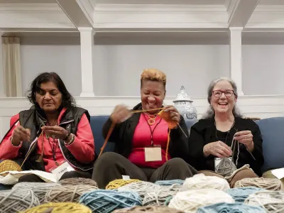 Three friends knitting