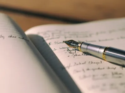 A pen on a notebook. 