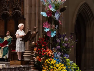 A parishioner is speaking at the altar