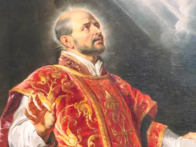 A priest in a red robe