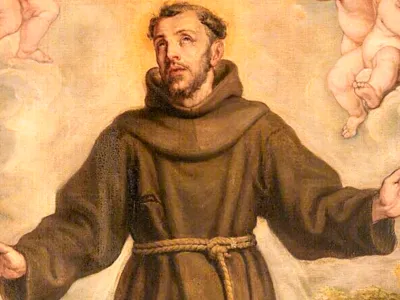 A priest surrounded by angels