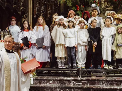 The kids line up with costumes at the altar.