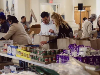 People pack groceries in St. Paul's Chapel