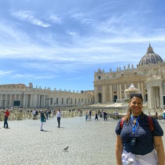 Woman stands in St. Peter's Square