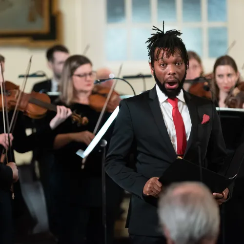 Jonathan Woody performs at St. Paul's Chapel in Handel's Messiah with violins in the background.