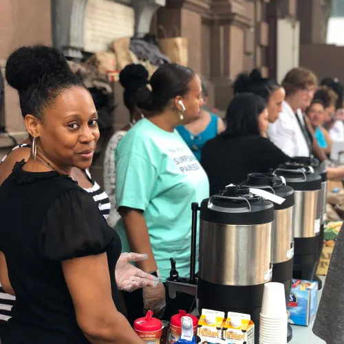 Volunteers serve Brown Bag Lunch