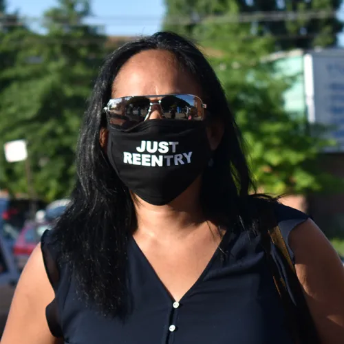 Susan Shah, wearing a Just Reentry mask at our Rikers Island Vigil