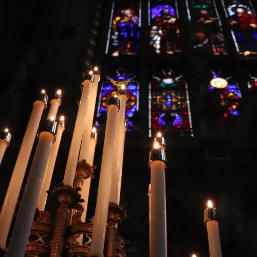 Astor candelabra and stained glass window in Trinity Church