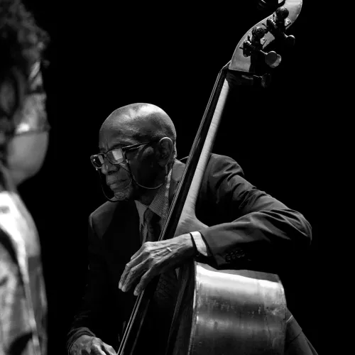 Reggie Workman plays an upright bass