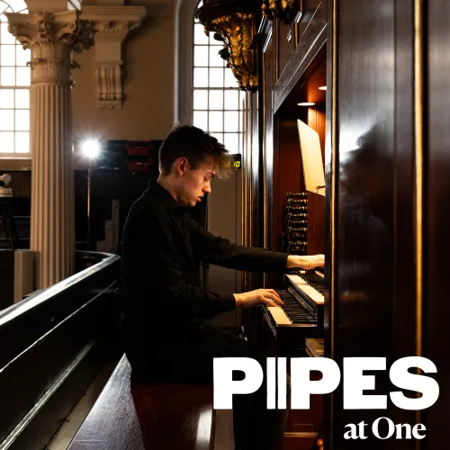 A musician is playing the Pipe organ in St. Paul's Chapel