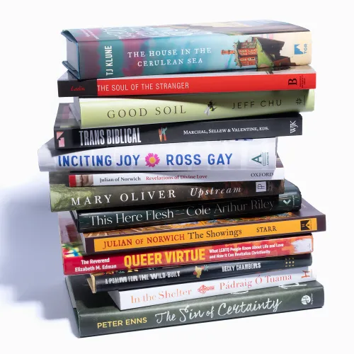 A stack of books over a white background